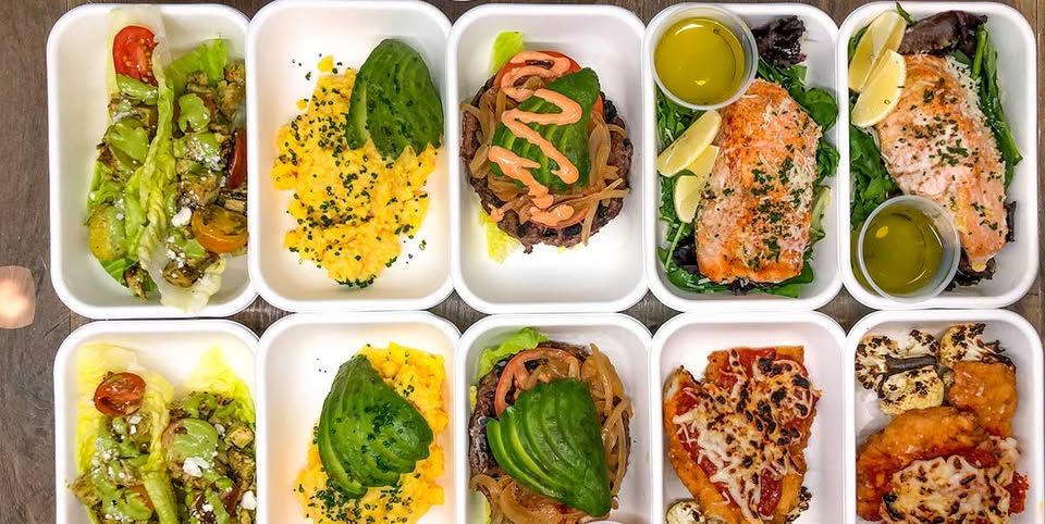 Ten meal-prep containers photographed from above: salads, eggs with avocado, burgers, salmon and chicken parmesan.